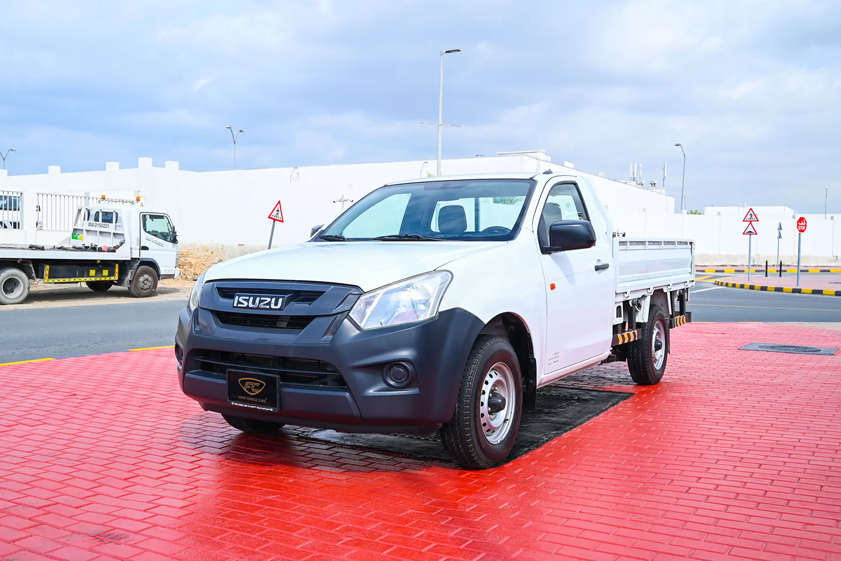 Used 2017 Isuzu D-MAX Flatbed White – Left Front Diagonal (45°) View at First Choice Cars Sharjah