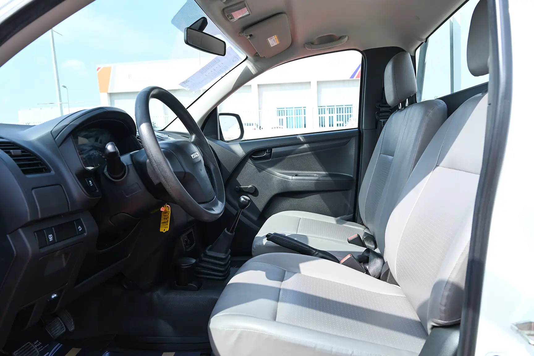 Used 2017 Isuzu D-MAX Flatbed White – Front Driver Side Cabin View at First Choice Cars Sharjah