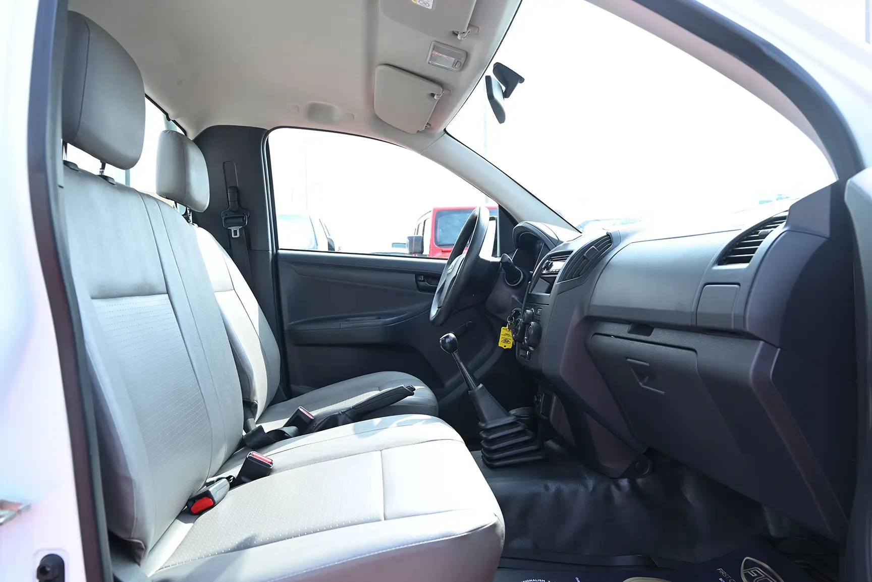 Used 2017 Isuzu D-MAX Flatbed White – Front Passenger Side Cabin View at First Choice Cars Sharjah