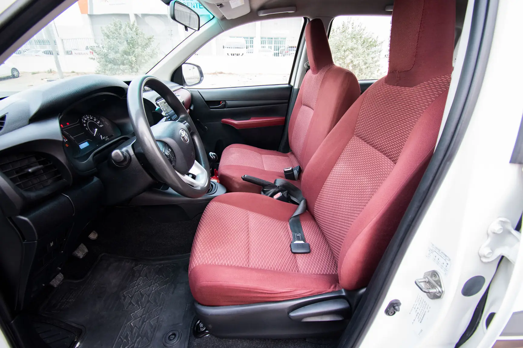 Used 2017 Toyota Hilux GL Double Cabin in White – Front Driver Side Cabin View for Sale at First Choice Cars Dubai Sharjah
