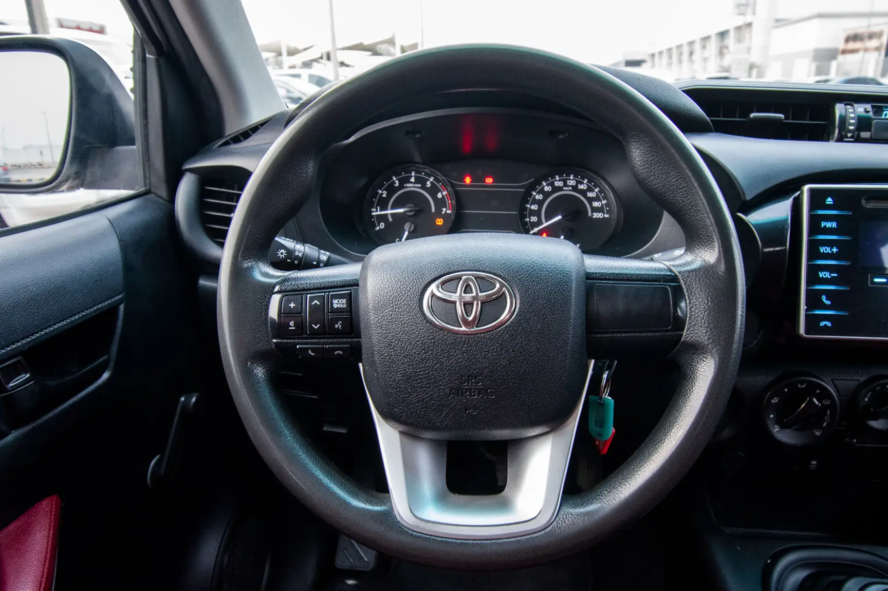 Used 2017 Toyota Hilux GL Double Cabin in White – Driver Side Dashboard & Steering View for Sale at First Choice Cars Dubai Sharjah