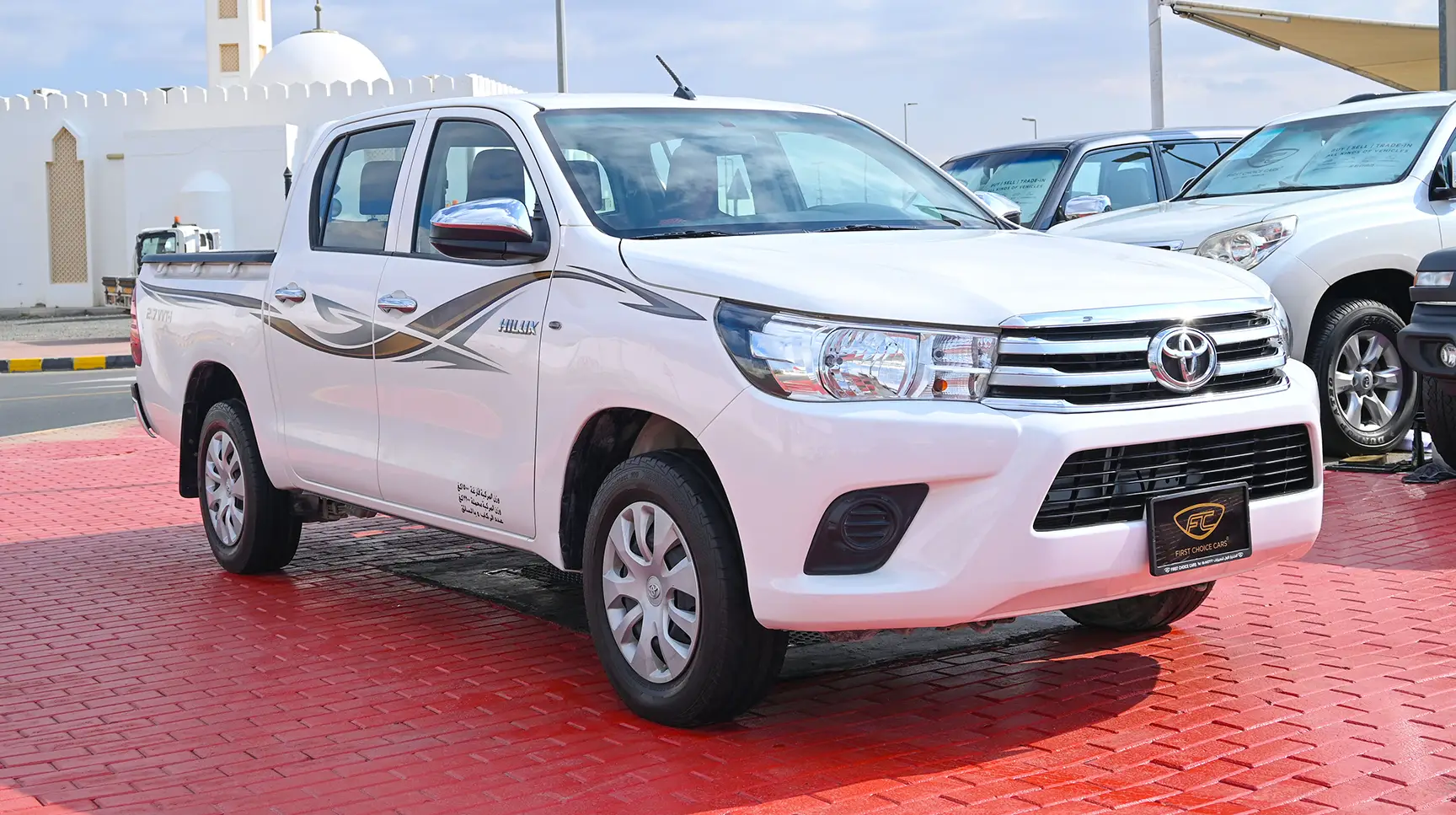 Used 2017 Toyota Hilux GL Double Cabin 2.7L 4x2 (petrol) White – Right Front Diagonal (45°) View at First Choice Cars Sharjah