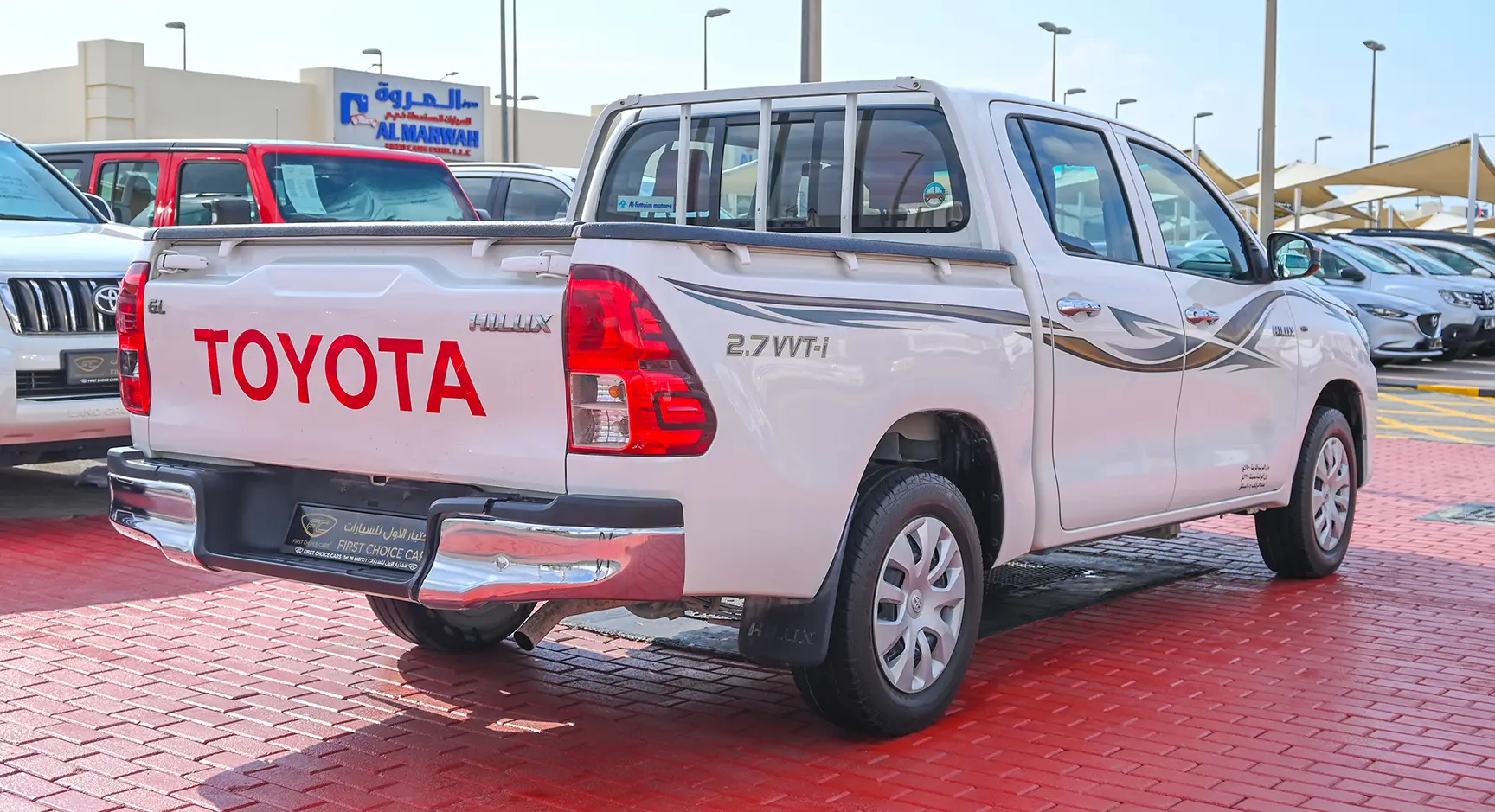 Used 2017 Toyota Hilux GL Double Cabin 2.7L 4x2 (petrol) White – Right Back Diagonal (45°) View at First Choice Cars Sharjah