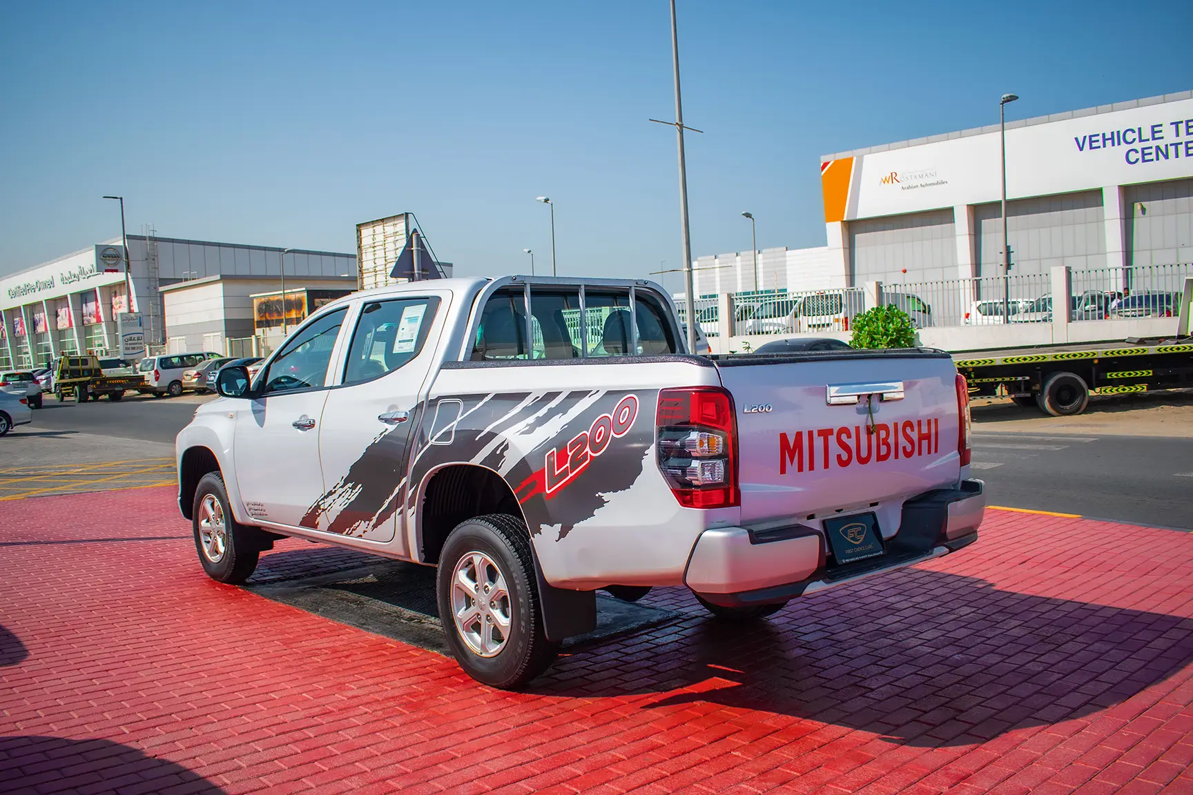 Used 2020 Mitsubishi L200 Double Cab GL White – Left Back Diagonal (45°) View at First Choice Cars Sharjah