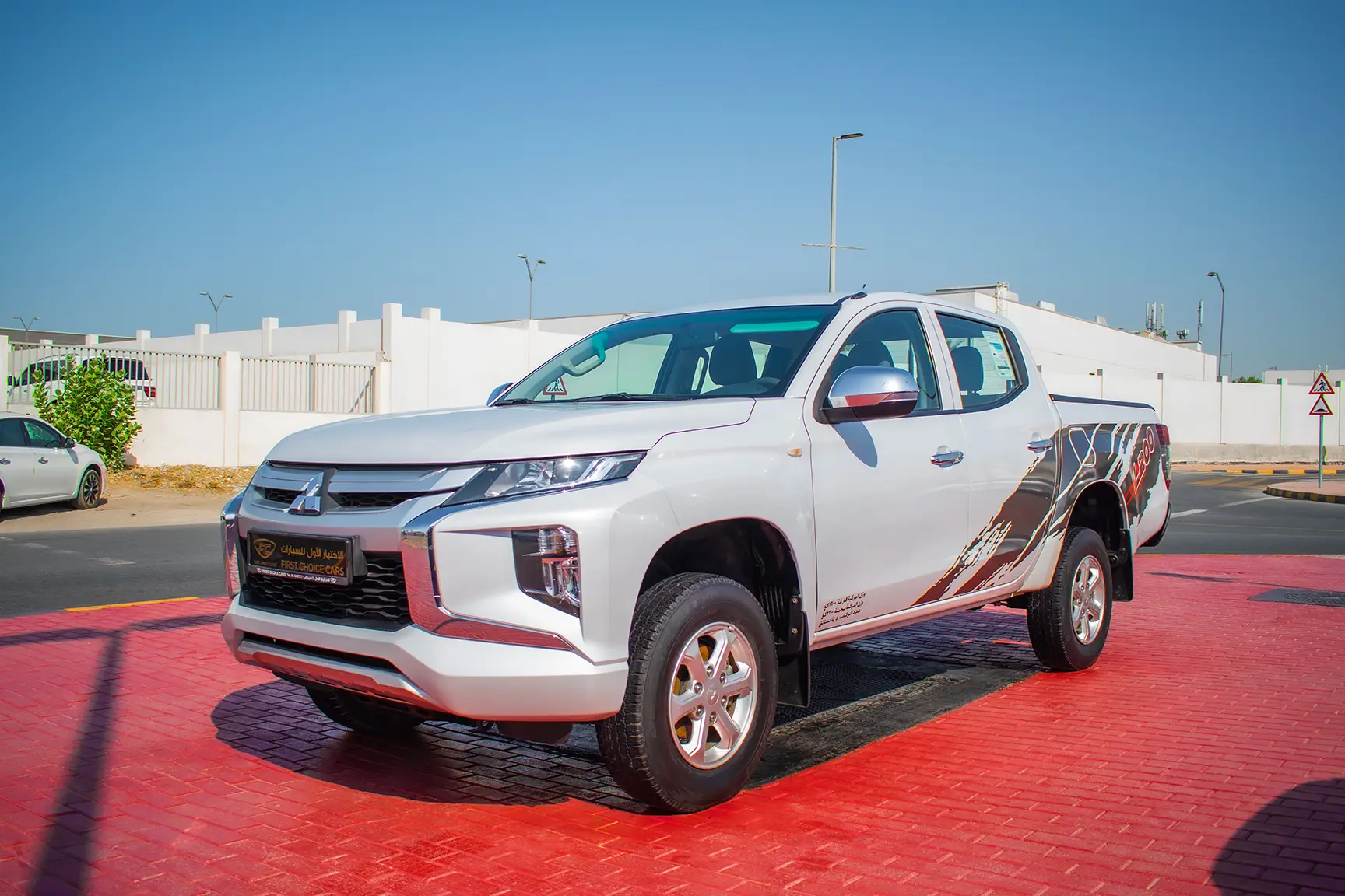 Used 2020 Mitsubishi L200 GL Double Cabin in White – Left Front Diagonal (45°) View for Sale at First Choice Cars Dubai Sharjah