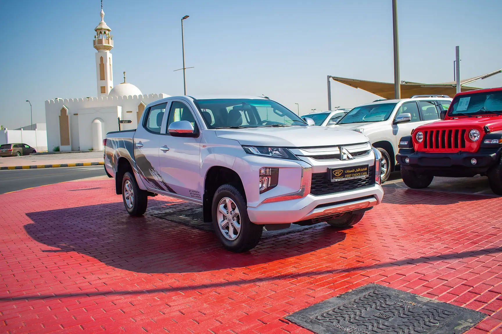 Used 2020 Mitsubishi L200 GL Double Cabin in White – Right Front Diagonal (45°) View for Sale at First Choice Cars Dubai Sharjah