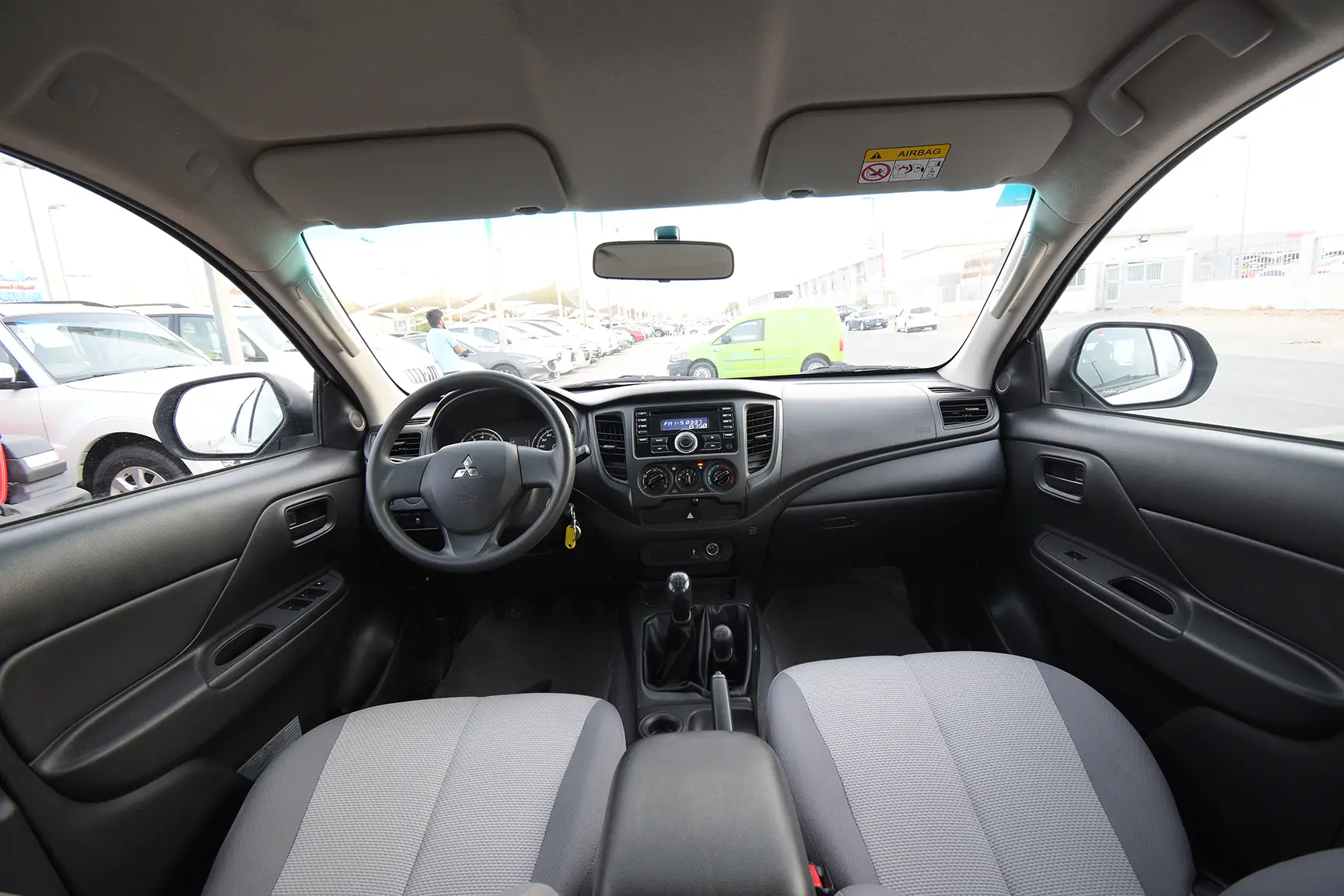 Used 2020 Mitsubishi L200 GL Double Cabin in White – Front Cabin / Dashboard Full View for Sale at First Choice Cars Dubai Sharjah