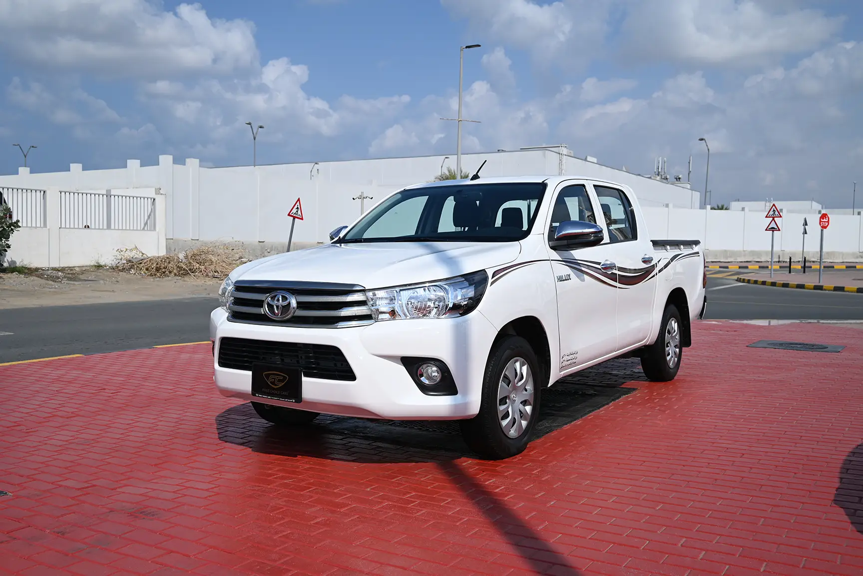 Used 2019 Toyota Hilux GL Double Cabin in White – Left Front Diagonal (45°) View for Sale at First Choice Cars Dubai Sharjah