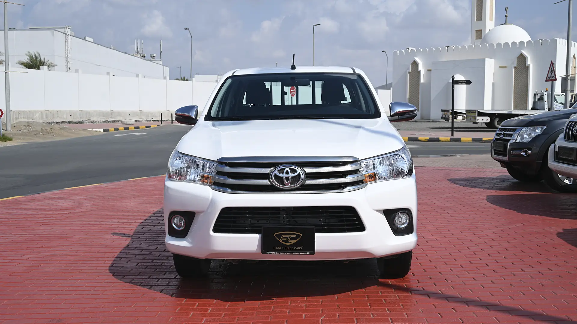 Used 2019 Toyota Hilux GL Double Cabin in White – Front View for Sale at First Choice Cars Dubai Sharjah