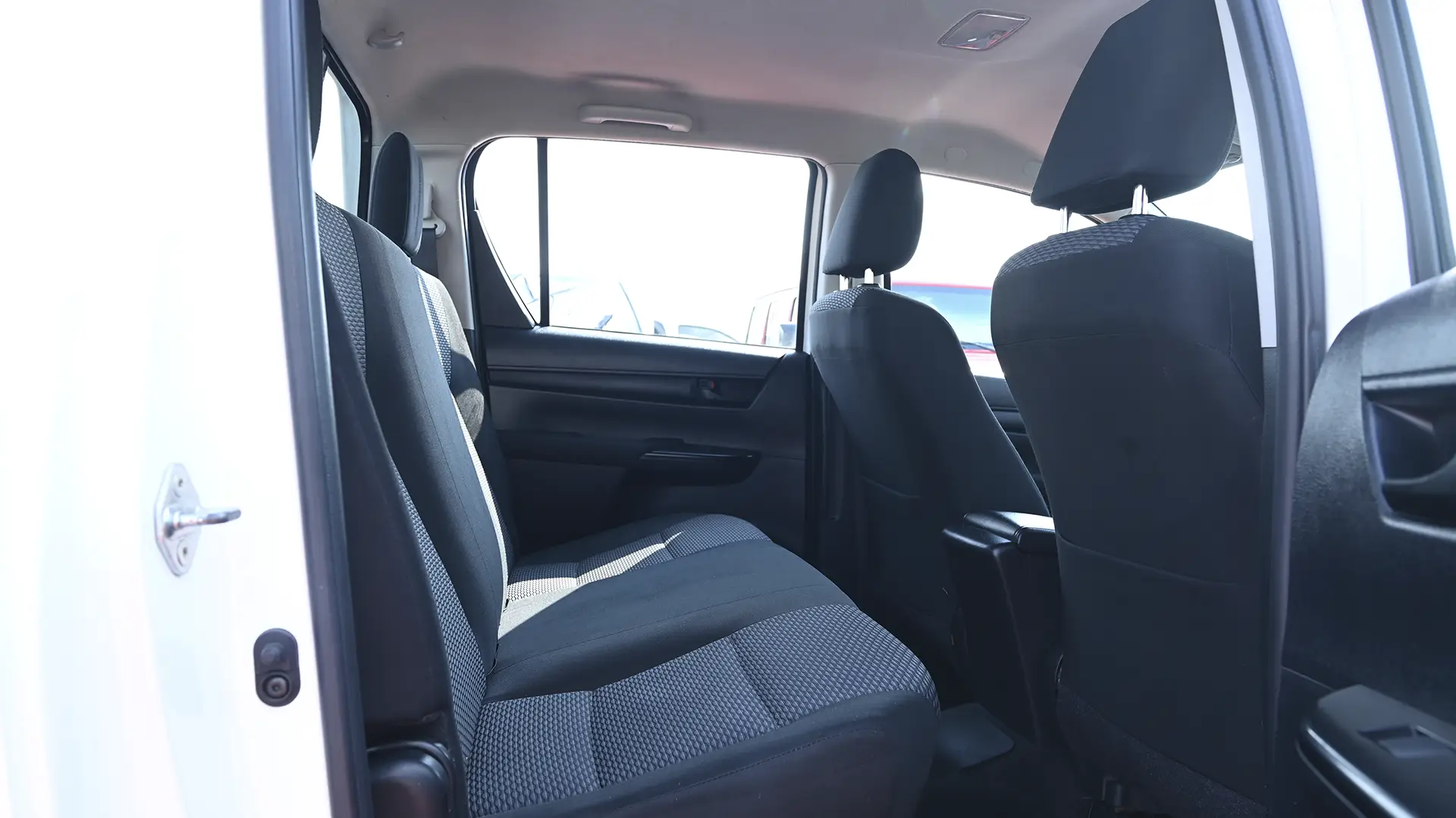 Used 2019 Toyota Hilux GL Double Cabin in White – Rear Passenger Side Cabin View for Sale at First Choice Cars Dubai Sharjah