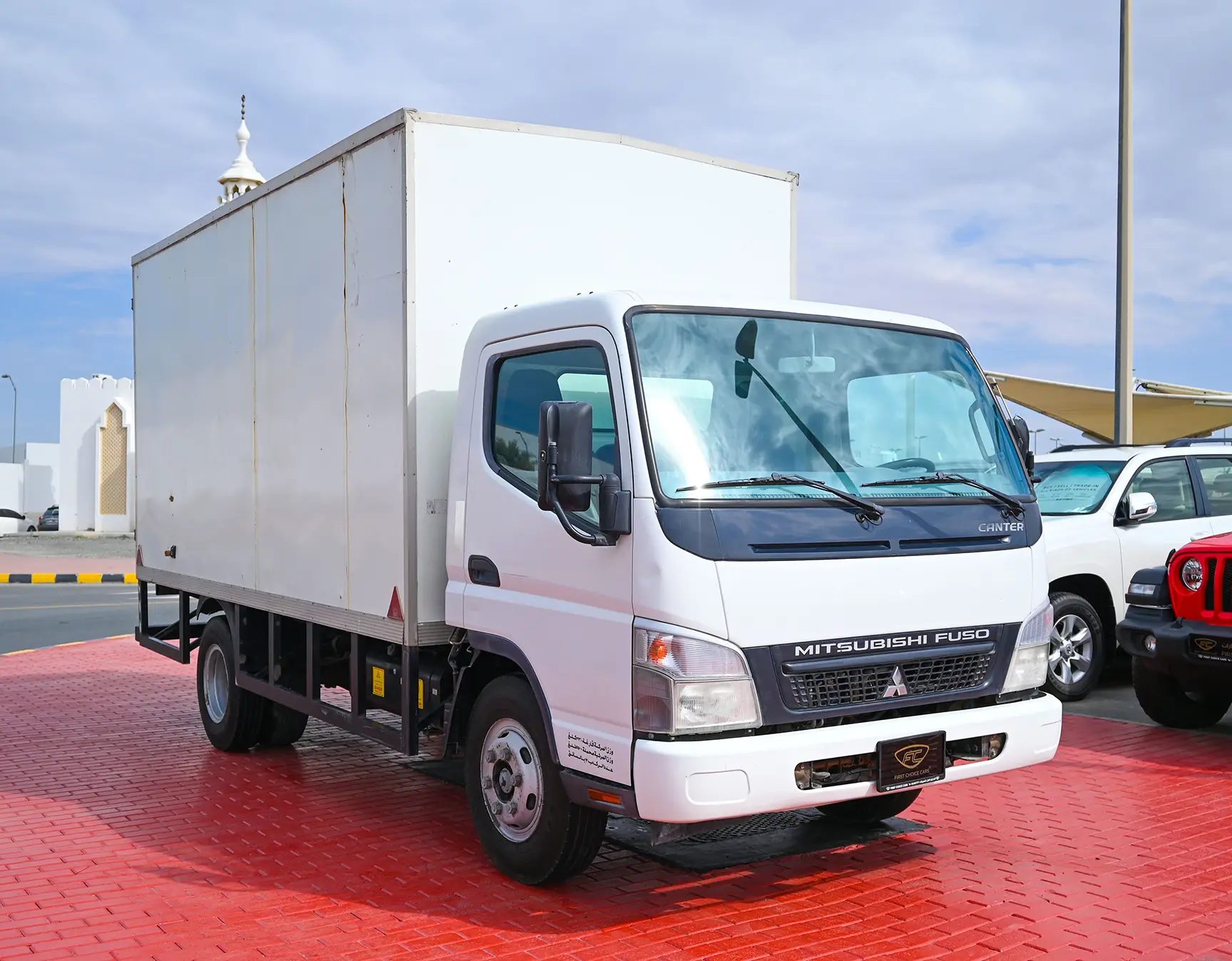 Used 2016 Mitsubishi Canter Cargo Box in White – Right Front Diagonal (45°) View for Sale at First Choice Cars Dubai Sharjah