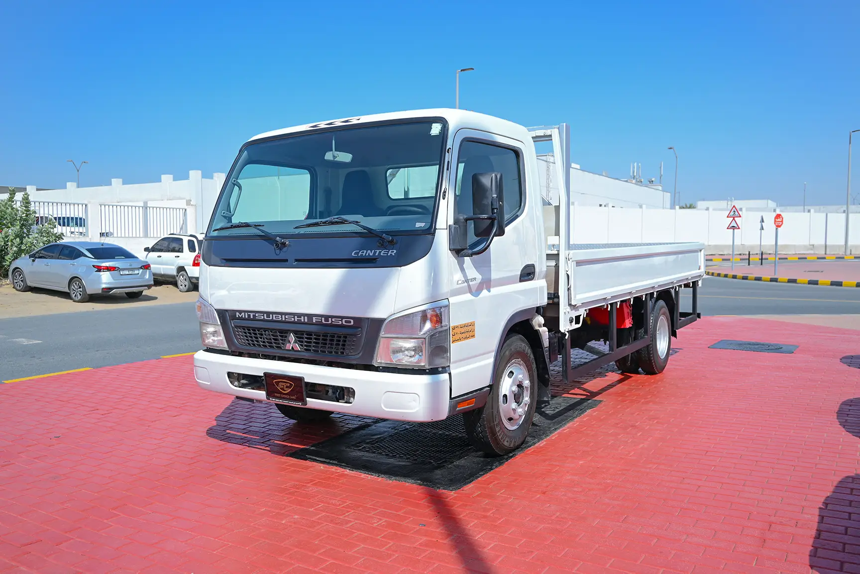Used 2016 Mitsubishi Canter Cargo Body in White – Left Front Diagonal (45°) View for Sale at First Choice Cars Dubai Sharjah