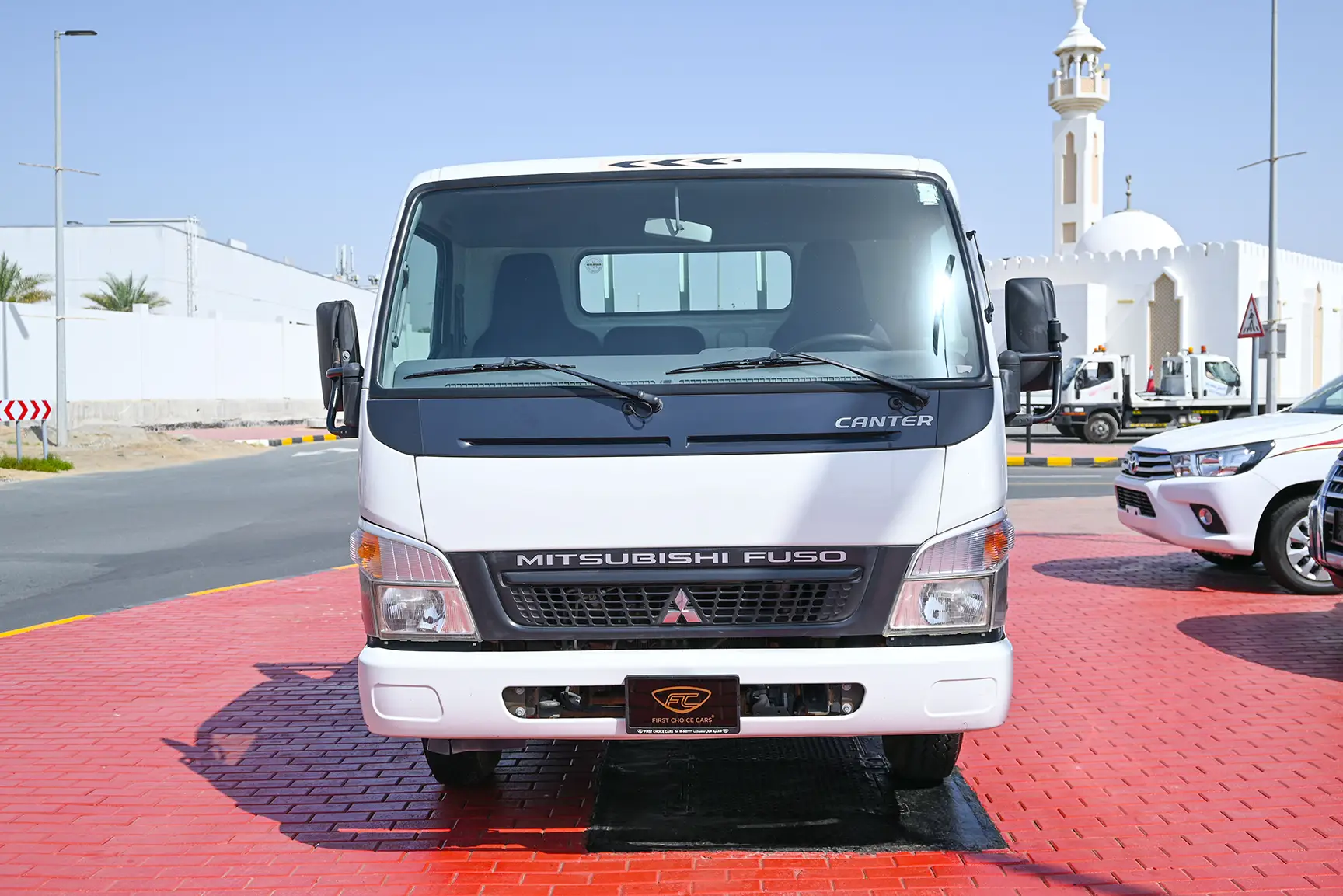 Used 2016 Mitsubishi Canter Cargo Body in White – Front View for Sale at First Choice Cars Dubai Sharjah