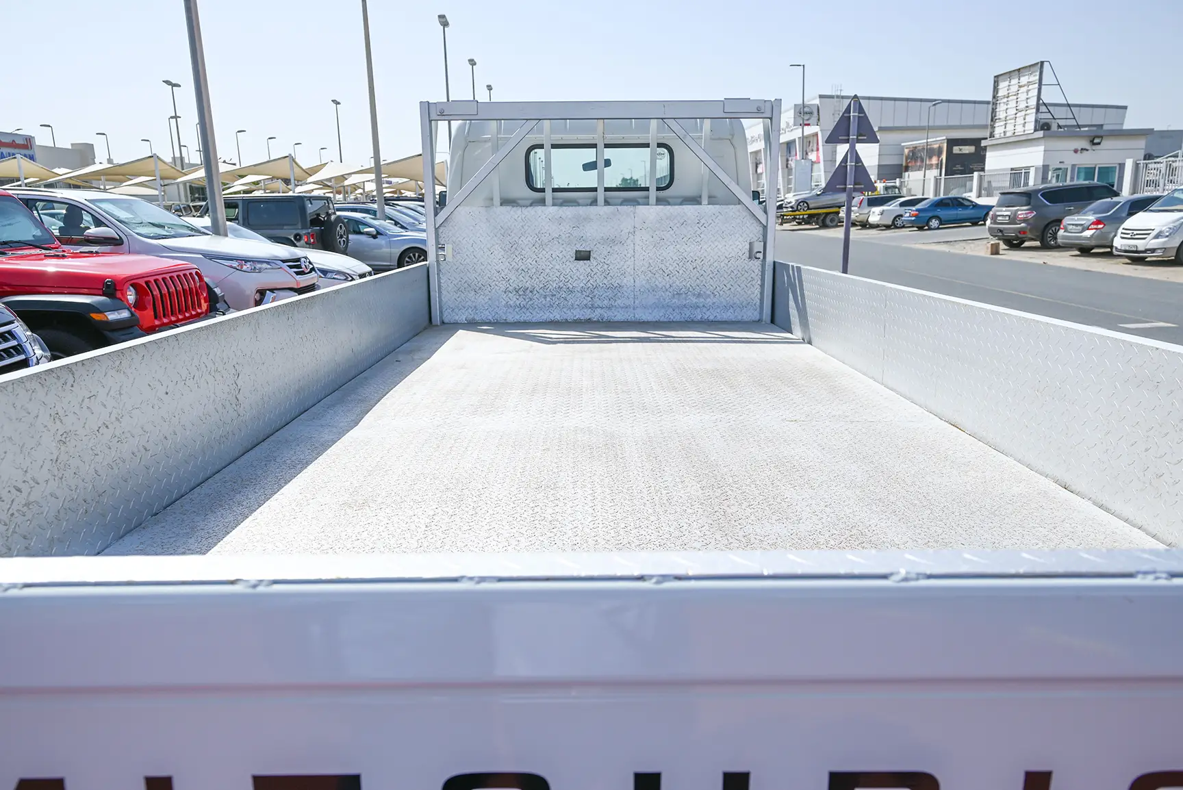 Used 2016 Mitsubishi Canter Cargo Body in White – Boot / Trunk Space Open View for Sale at First Choice Cars Dubai Sharjah