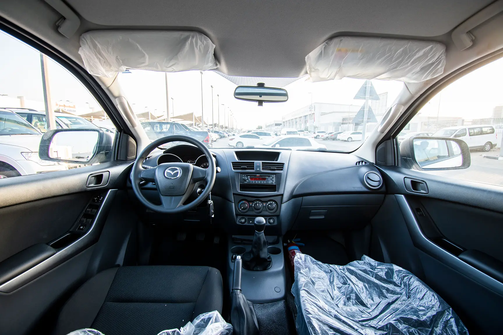 Used 2020 Mazda BT-50 Double Cab 4WD White – Front Cabin / Dashboard Full View at First Choice Cars Sharjah