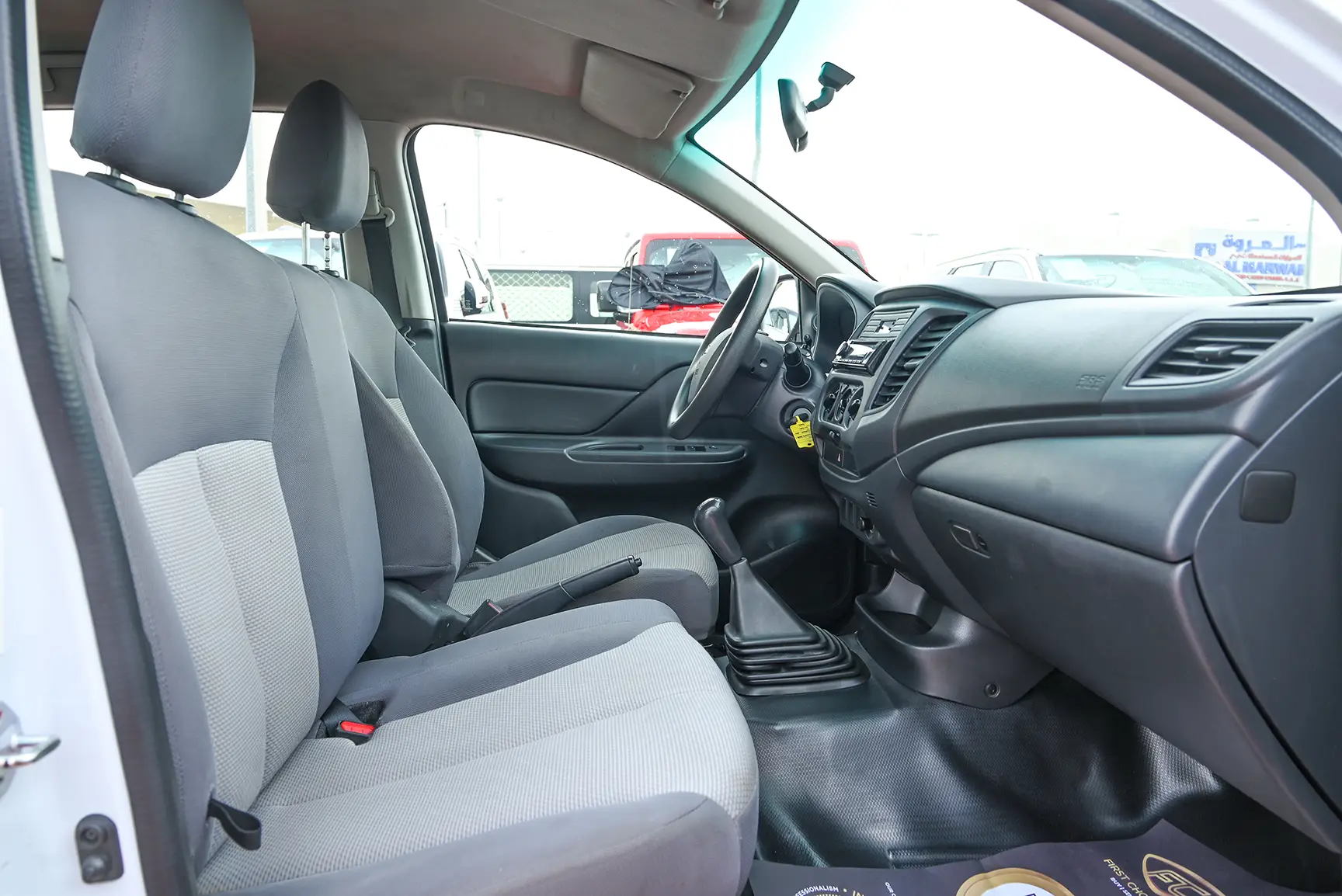 Used 2020 Mitsubishi L200 GL Double Cabin White – Front Passenger Side Cabin View at First Choice Cars Sharjah