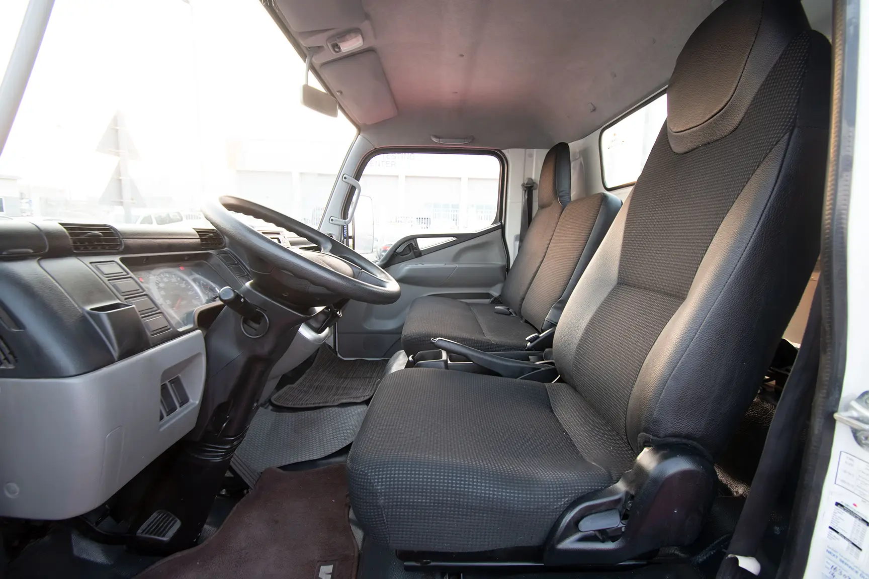 Used 2017 Mitsubishi Canter Cargo Body White – Front Driver Side Cabin View at First Choice Cars Sharjah