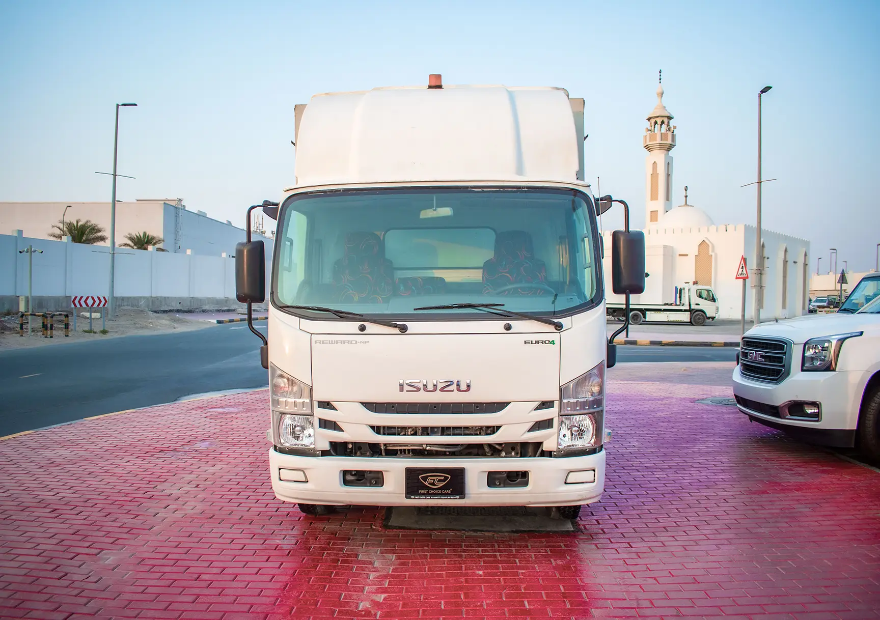 Used 2020 Isuzu NPR Shutter Body White – Front View at First Choice Cars Sharjah