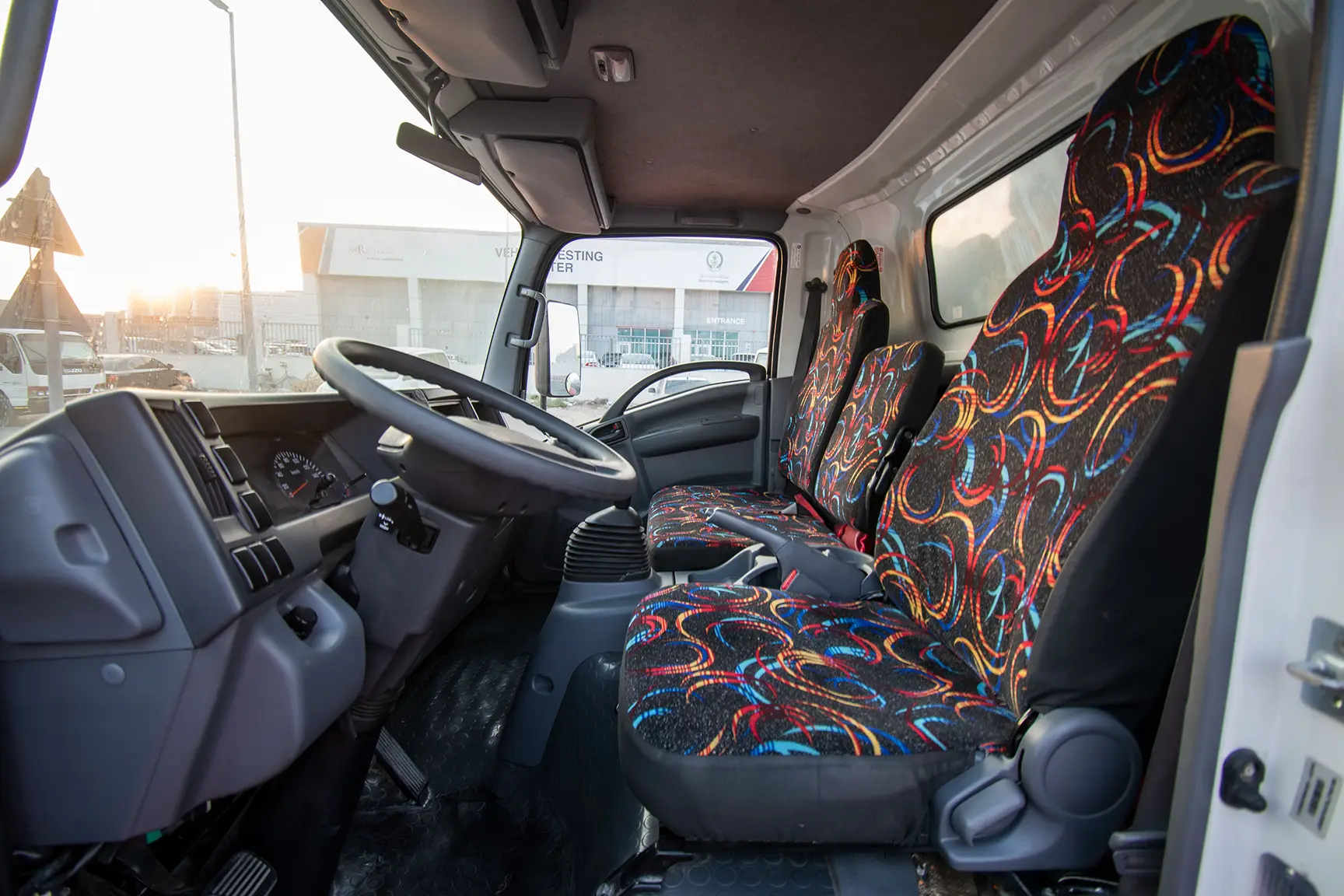 Used 2020 Isuzu NPR Shutter Body White – Front Driver Side Cabin View at First Choice Cars Sharjah