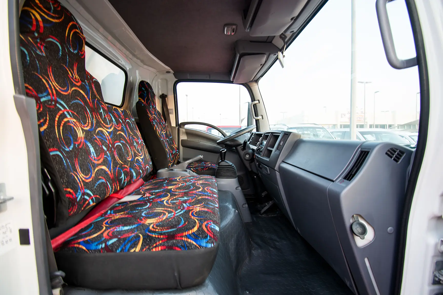 Used 2020 Isuzu NPR Shutter Body White – Front Passenger Side Cabin View at First Choice Cars Sharjah