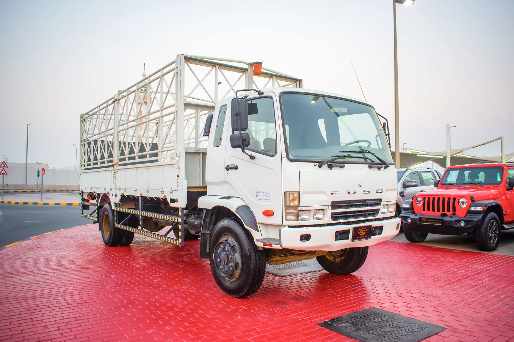 Used 2016 Mitsubishi Canter Cargo Body in White – Right Front Diagonal (45°) View for Sale at First Choice Cars Dubai Sharjah