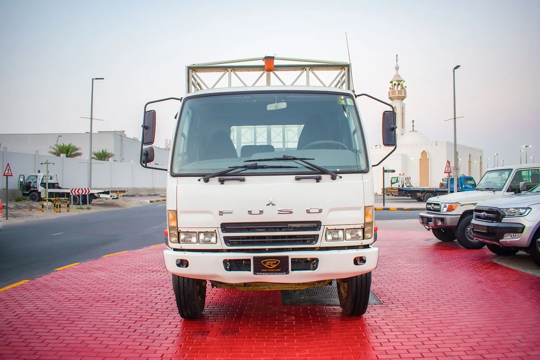 Used 2016 Mitsubishi Canter Cargo Body in White – Front View for Sale at First Choice Cars Dubai Sharjah