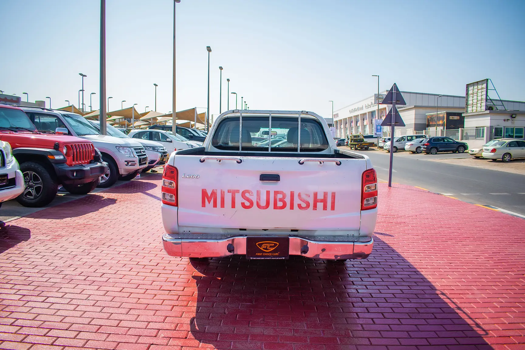 Used 2016 Mitsubishi L200 Double Cab GL White – Back/Rear View at First Choice Cars Sharjah