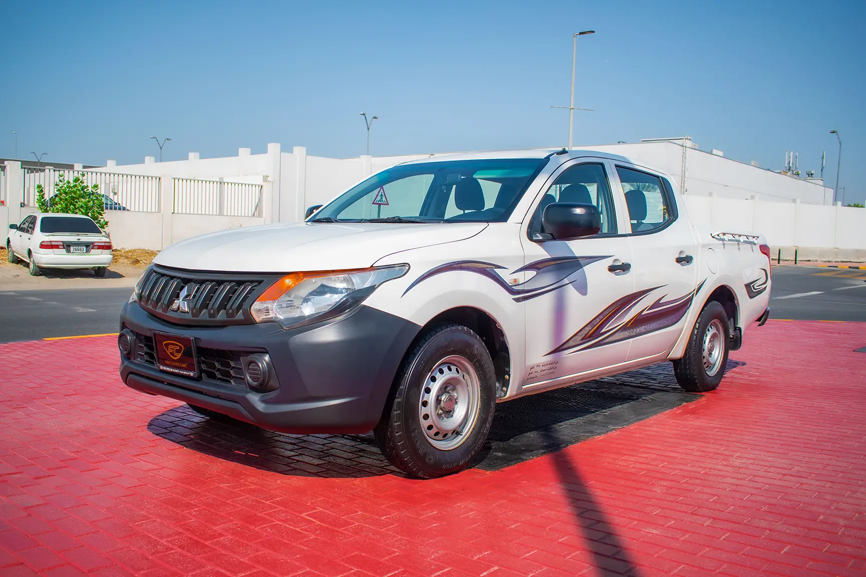 Used 2016 Mitsubishi L200 GL Double Cabin in White – Left Front Diagonal (45°) View for Sale at First Choice Cars Dubai Sharjah