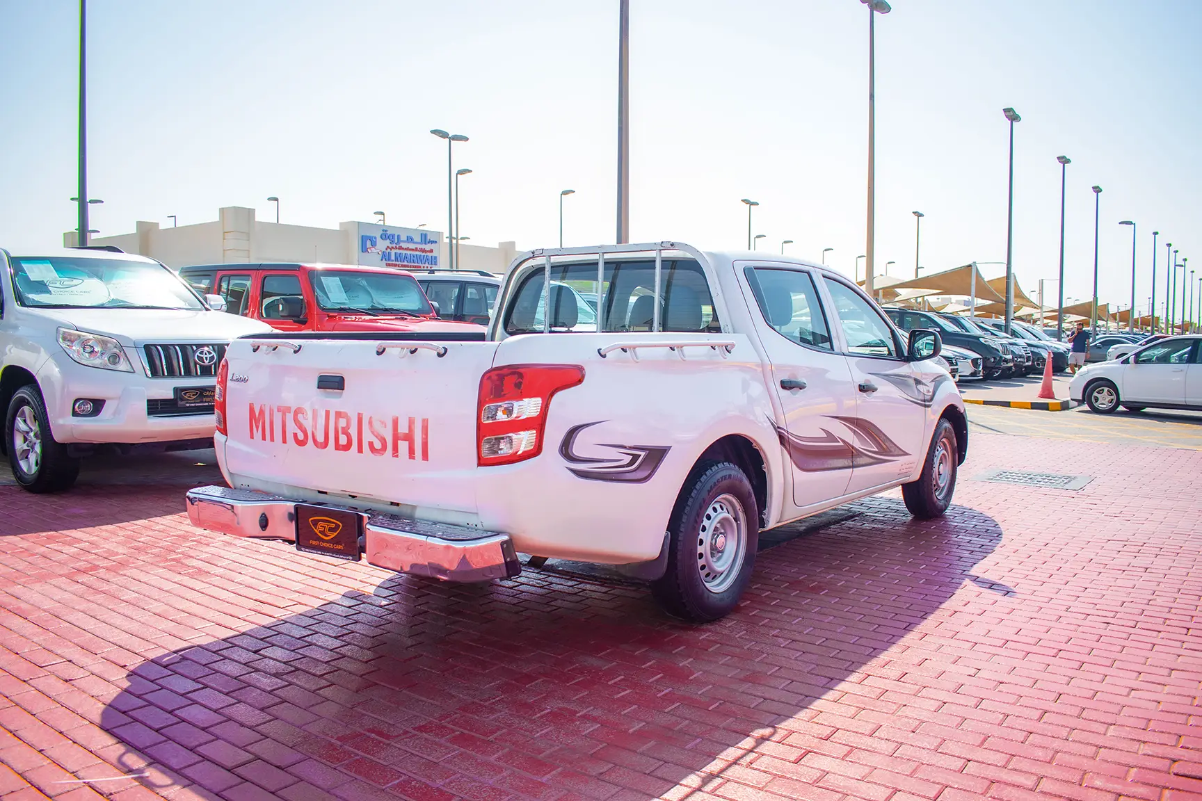 Used 2016 Mitsubishi L200 GL Double Cabin in White – Right Back Diagonal (45°) View for Sale at First Choice Cars Dubai Sharjah