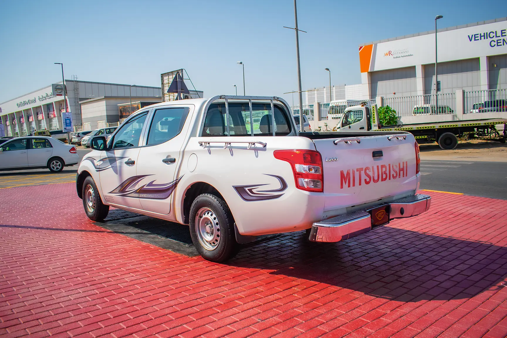 Used 2016 Mitsubishi L200 GL Double Cabin in White – Left Back Diagonal (45°) View for Sale at First Choice Cars Dubai Sharjah
