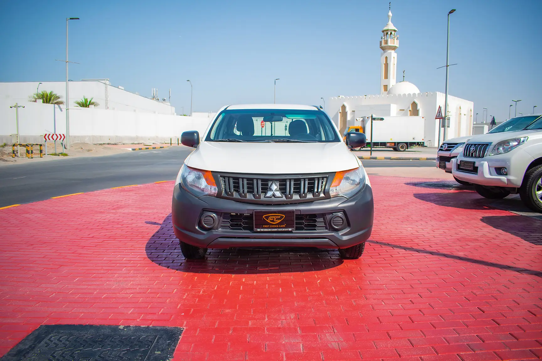 Used 2016 Mitsubishi L200 GL Double Cabin in White – Front View for Sale at First Choice Cars Dubai Sharjah