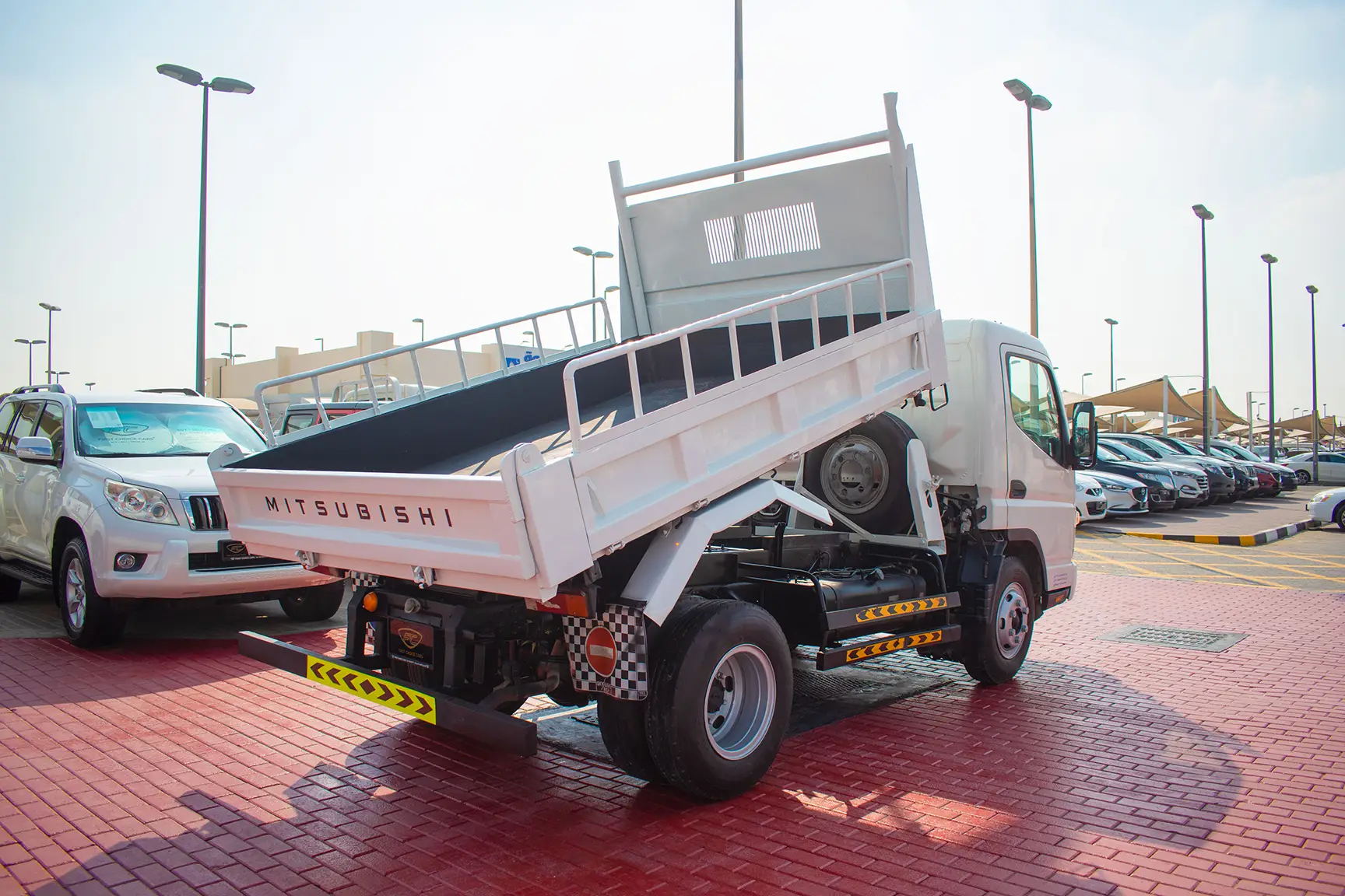Used 2016 Mitsubishi Canter Tipper in White – Right Back Diagonal (45°) View for Sale at First Choice Cars Dubai Sharjah