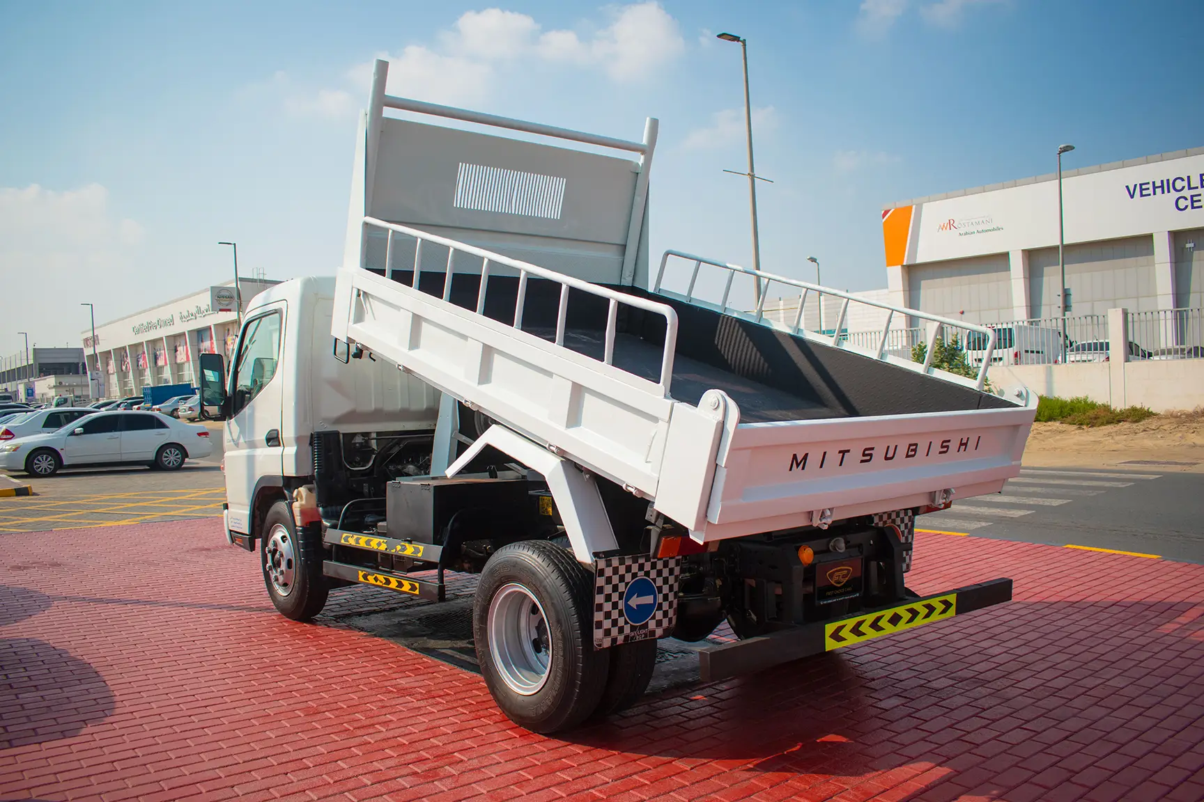 Used 2016 Mitsubishi Canter Tipper in White – Left Back Diagonal (45°) View for Sale at First Choice Cars Dubai Sharjah