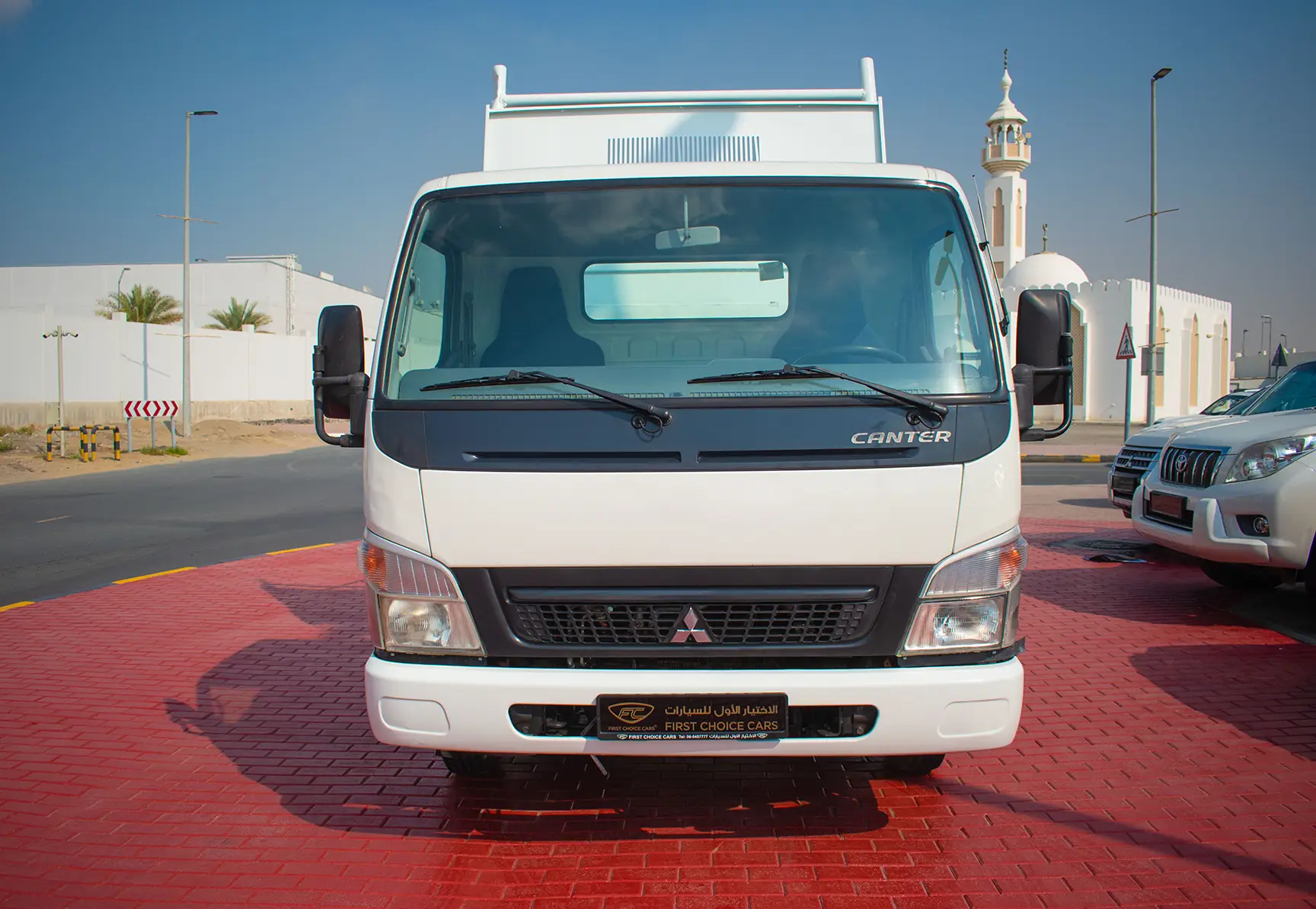 Used 2016 Mitsubishi Canter Tipper in White – Front View for Sale at First Choice Cars Dubai Sharjah