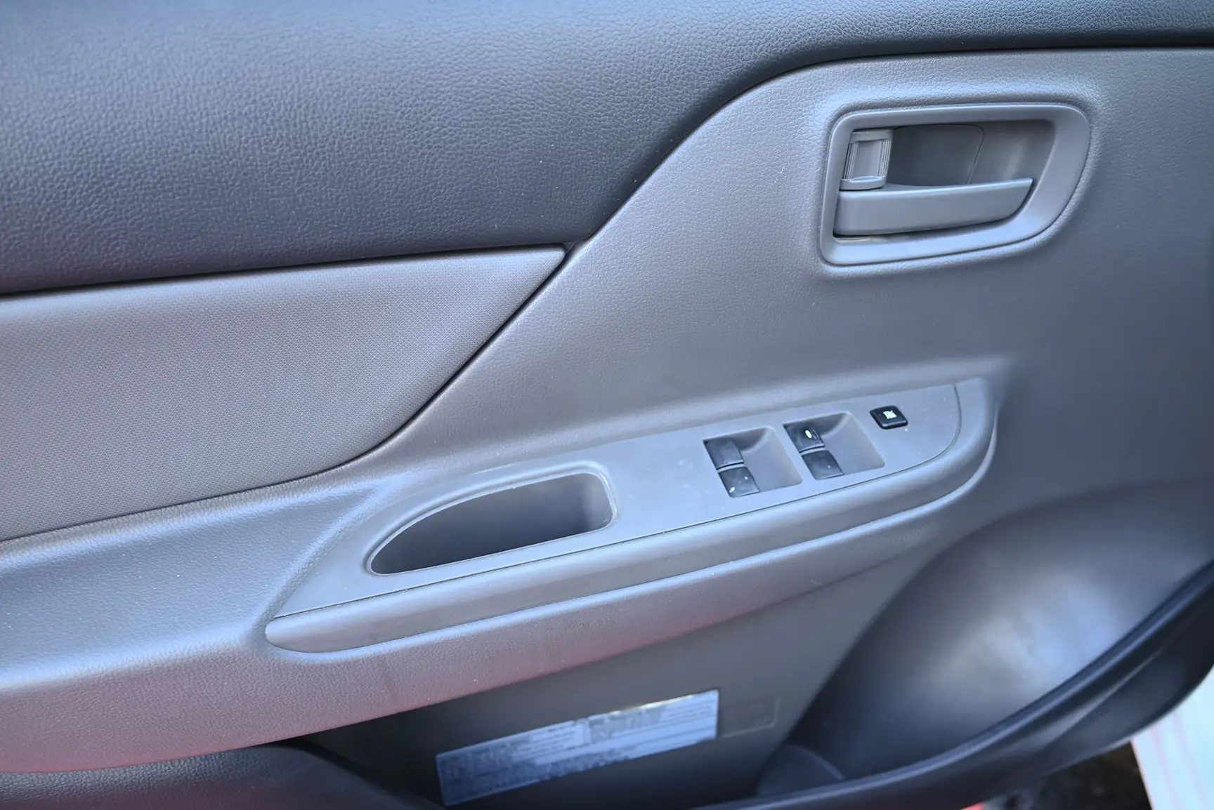 Used 2017 Mitsubishi L200 Double Cab GL White – Driver Door Panel Full View at First Choice Cars Sharjah