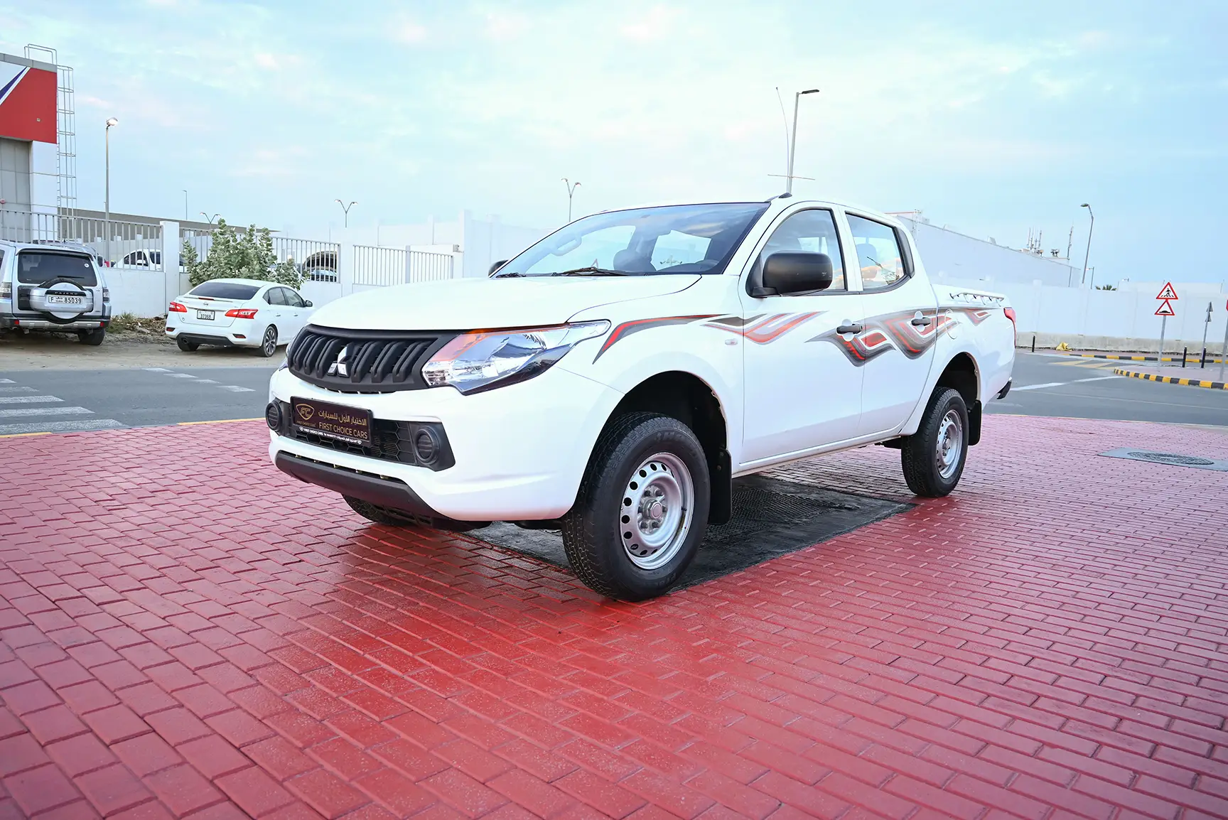 Used 2017 Mitsubishi L200 GL Double Cabin in White – Left Front Diagonal (45°) View for Sale at First Choice Cars Dubai Sharjah