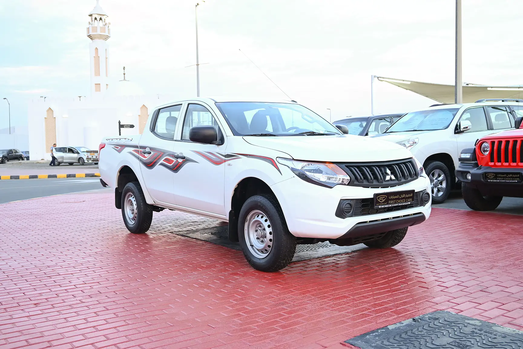 Used 2017 Mitsubishi L200 GL Double Cabin in White – Right Front Diagonal (45°) View for Sale at First Choice Cars Dubai Sharjah