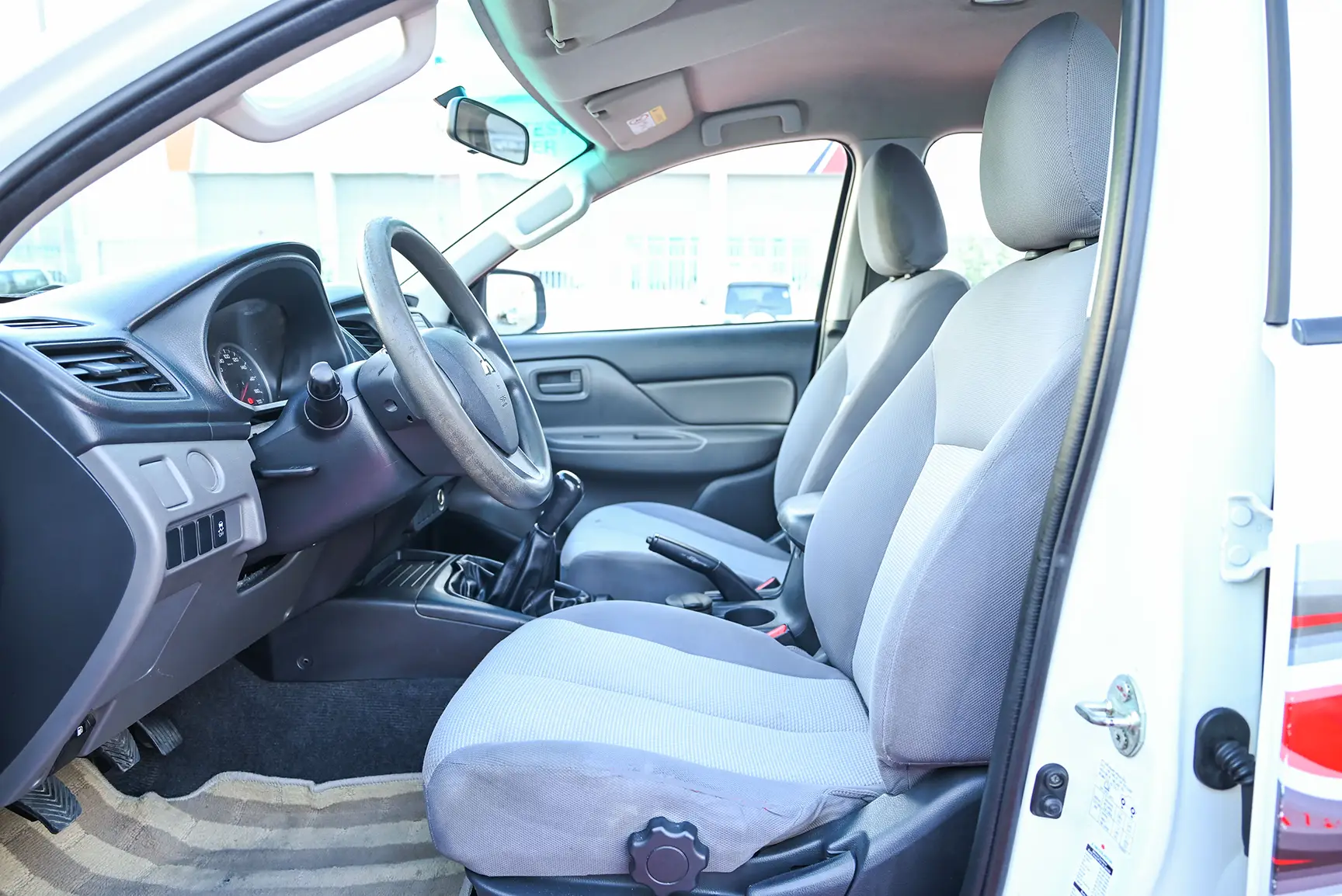 Used 2017 Mitsubishi L200 GL Double Cabin in White – Front Driver Side Cabin View for Sale at First Choice Cars Dubai Sharjah