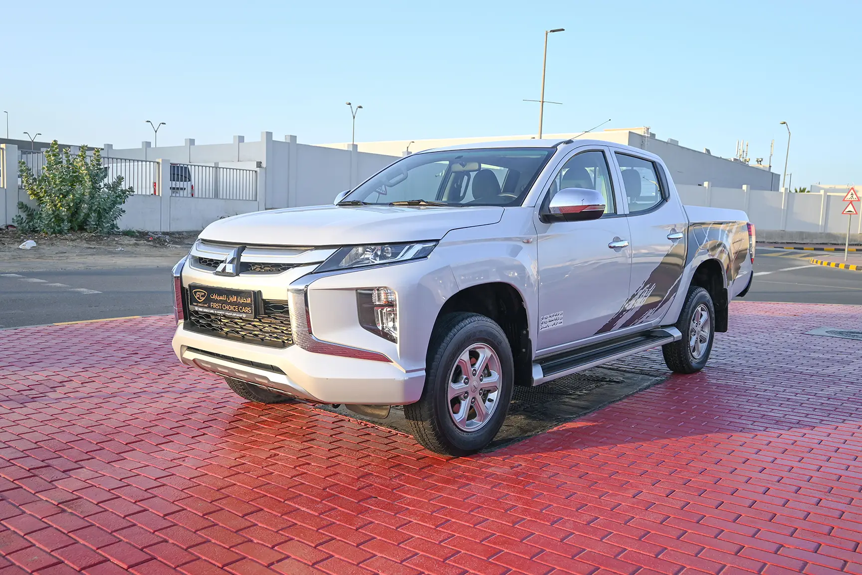 Used 2020 Mitsubishi L200 GL Double Cabin in White – Left Front Diagonal (45°) View for Sale at First Choice Cars Dubai Sharjah