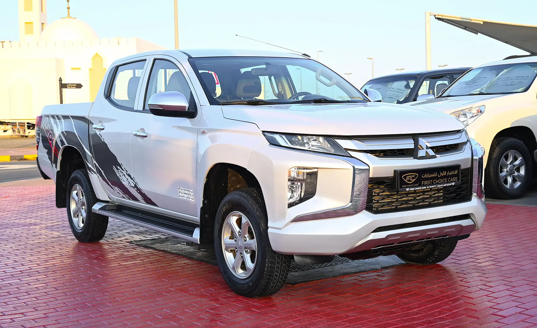 Used 2020 Mitsubishi L200 GL Double Cabin in White – Right Front Diagonal (45°) View for Sale at First Choice Cars Dubai Sharjah