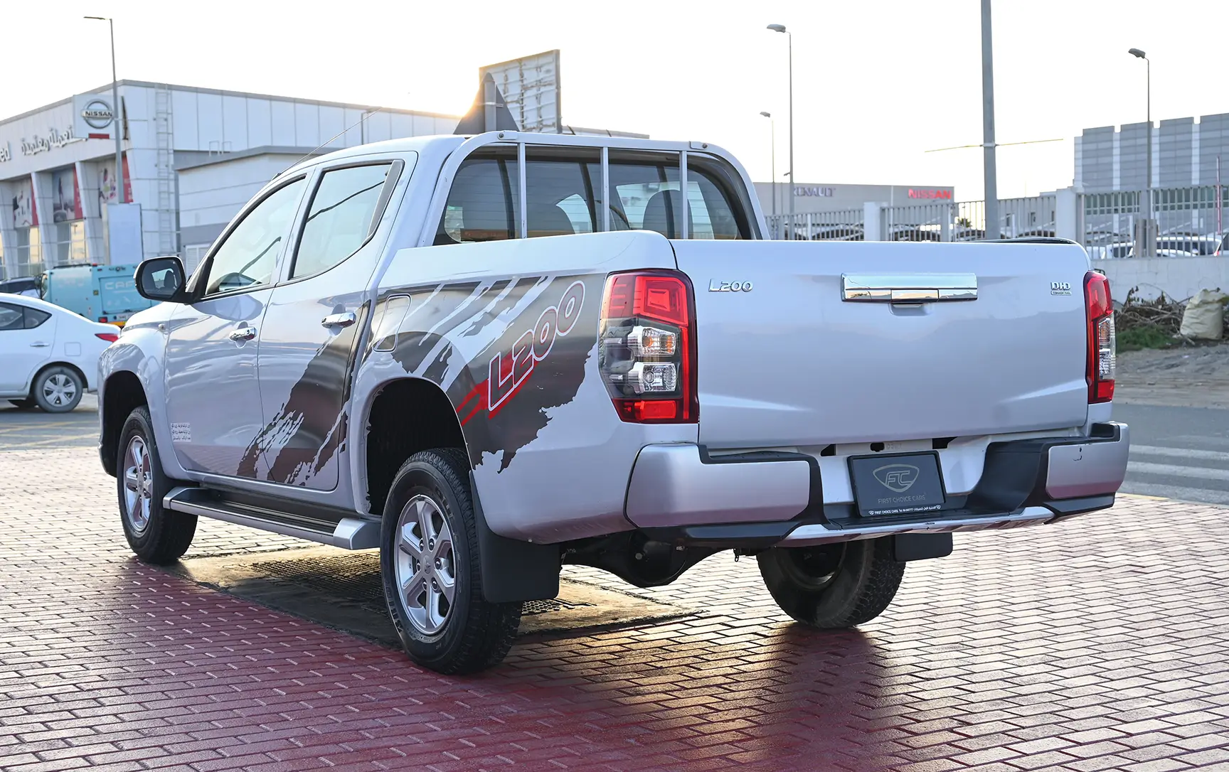 Used 2020 Mitsubishi L200 GL Double Cabin in White – Left Back Diagonal (45°) View for Sale at First Choice Cars Dubai Sharjah