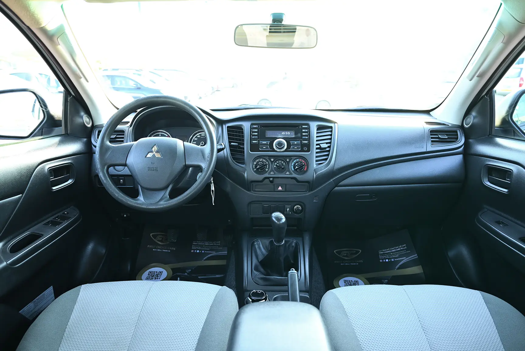 Used 2020 Mitsubishi L200 GL Double Cabin in White – Front Cabin / Dashboard Full View for Sale at First Choice Cars Dubai Sharjah