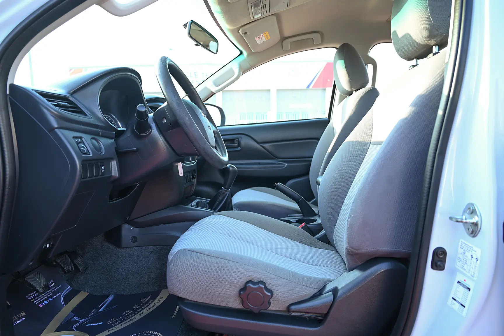 Used 2020 Mitsubishi L200 GL Double Cabin in White – Front Driver Side Cabin View for Sale at First Choice Cars Dubai Sharjah