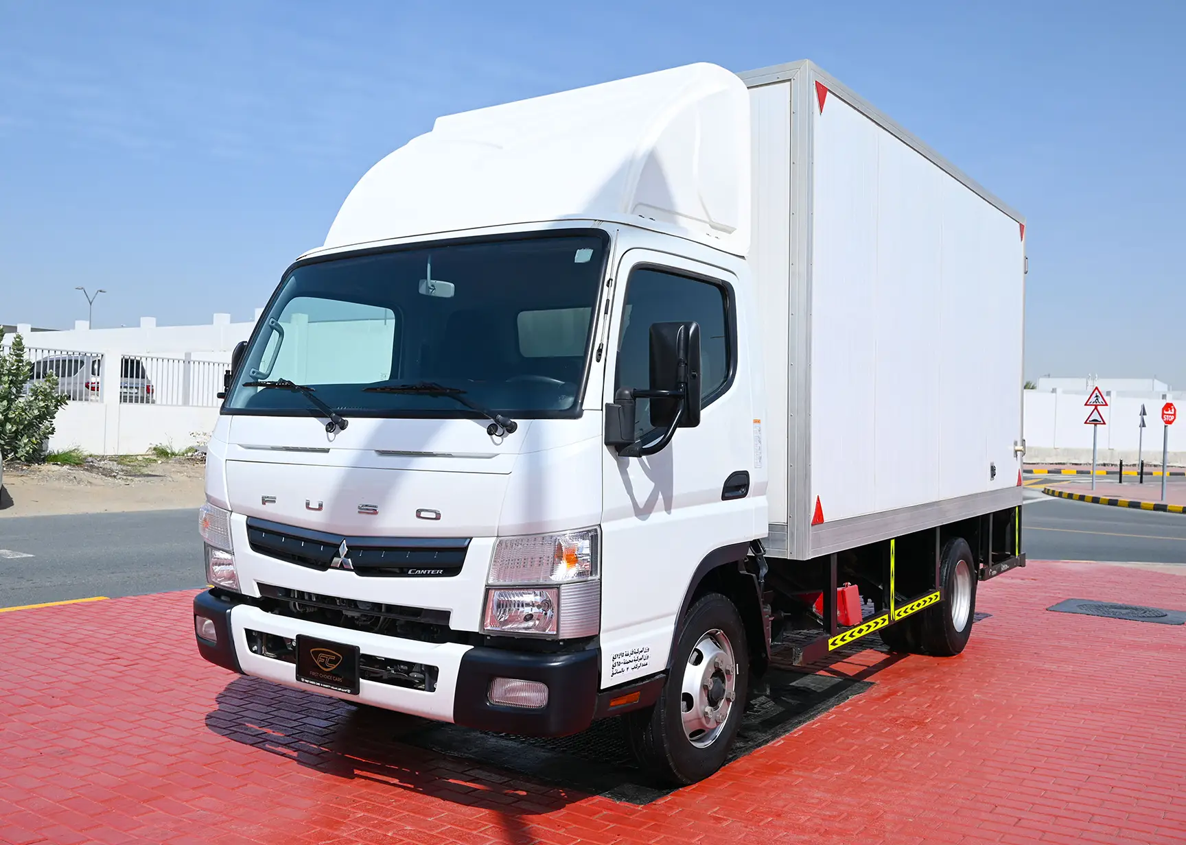 Used 2021 Mitsubishi Canter Cargo Box in White – Left Front Diagonal (45°) View for Sale at First Choice Cars Dubai Sharjah