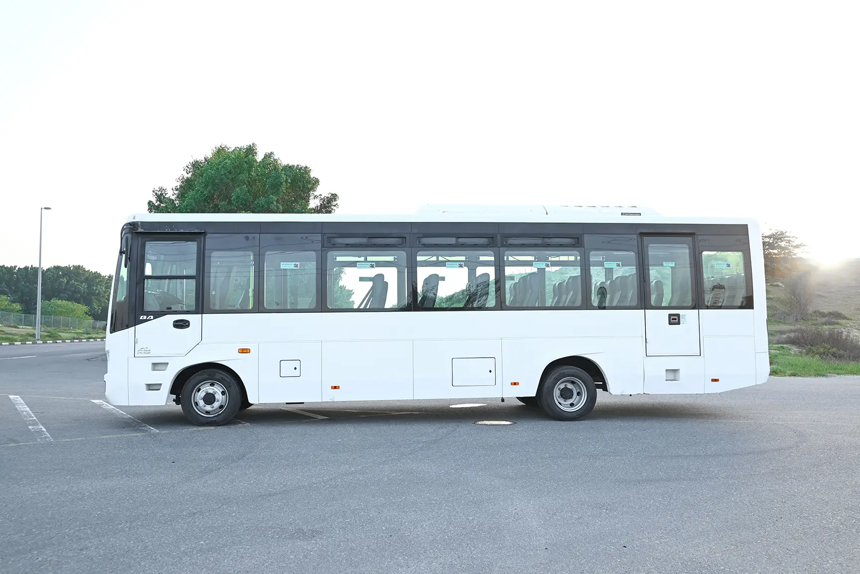 Used 2020 Mitsubishi Fuso Bus 37-Seater White – Left Back Diagonal (45°) View at First Choice Cars Sharjah