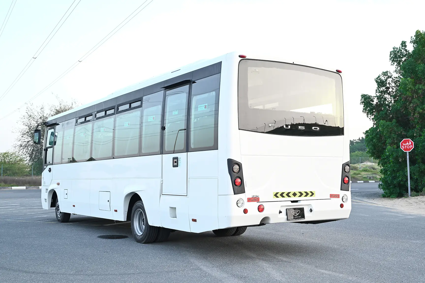 Used 2020 Mitsubishi Fuso Bus 37-Seater White – Left Back Diagonal (45°) View at First Choice Cars Sharjah