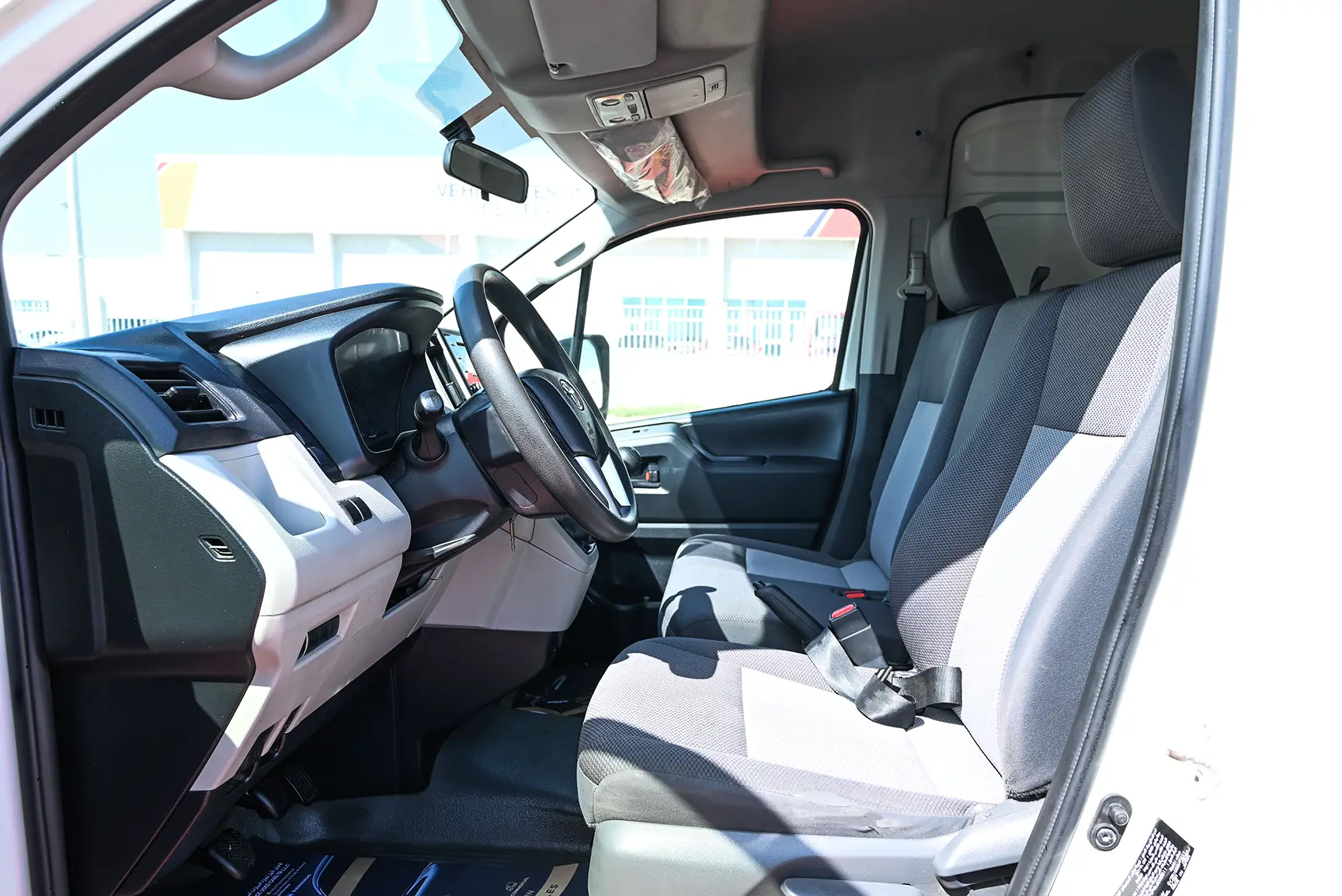 Used 2020 Toyota Hiace GL High Roof White – Driver Side Dashboard & Steering View at First Choice Cars Sharjah
