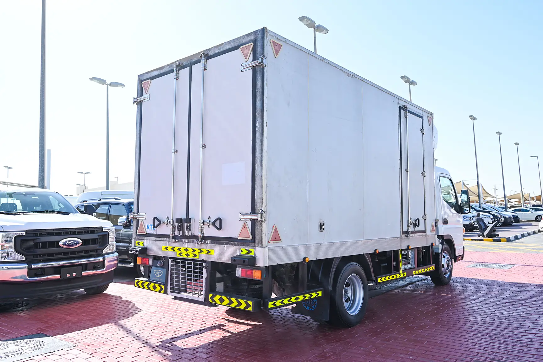 Used 2022 Mitsubishi Canter Freezer Box White – Right Back Diagonal (45°) View at First Choice Cars Sharjah