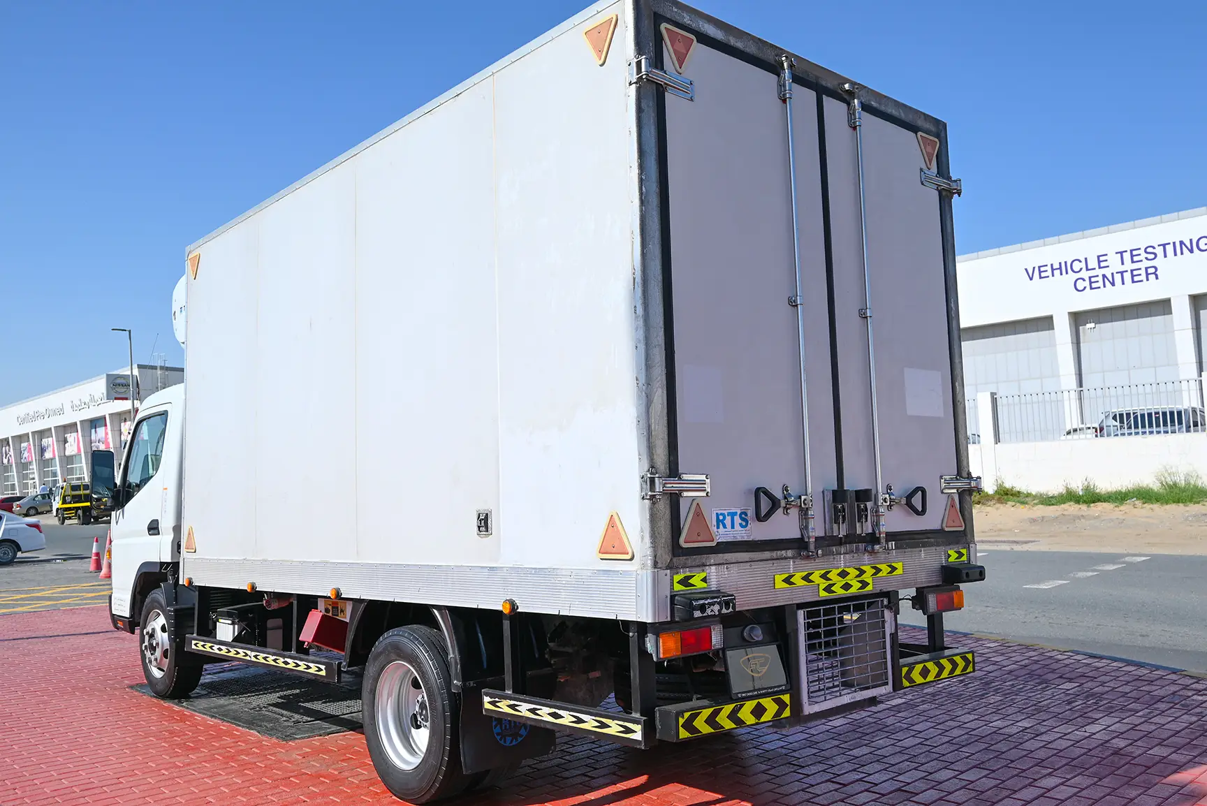 Used 2022 Mitsubishi Canter Freezer Box White – Left Back Diagonal (45°) View at First Choice Cars Sharjah