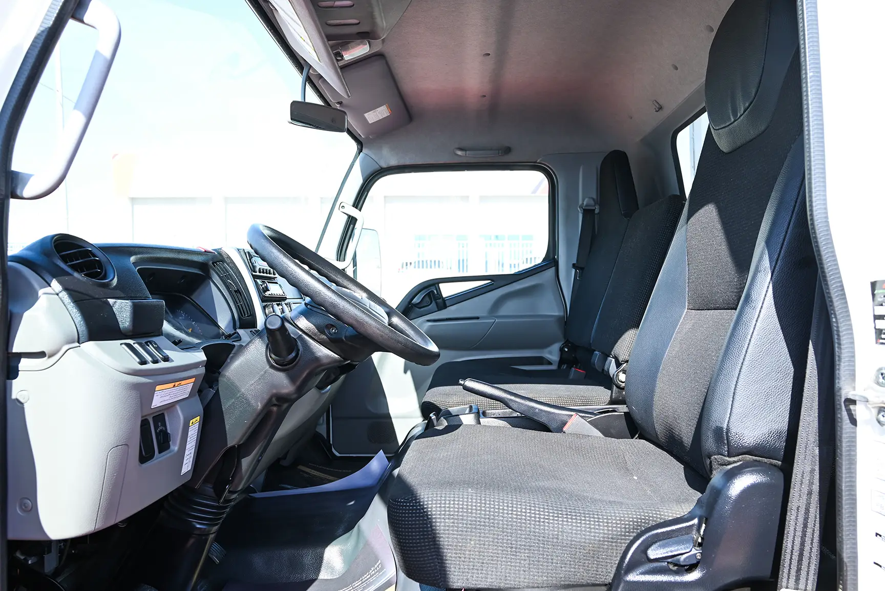 Used 2022 Mitsubishi Canter Freezer Box White – Front Driver Side Cabin View at First Choice Cars Sharjah